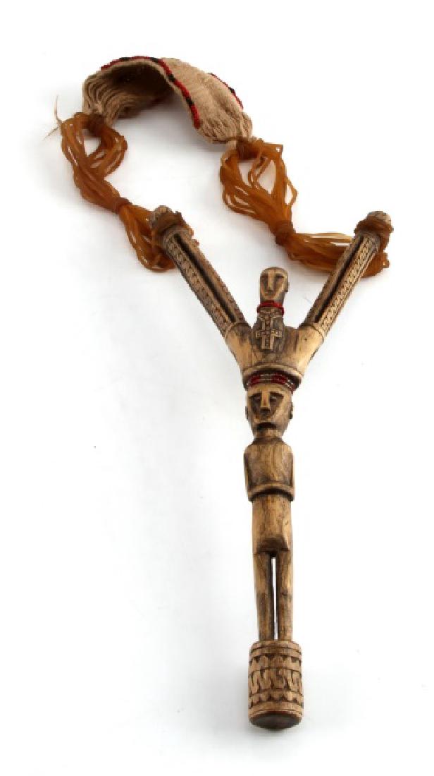 ANTIQUE NATIVE AMERICAN PLAINS INDIAN SLING SHOT: Christian influenced probably willow wood , nice detail, with rubber band pulls and linen beaded sling, wear and use patination but age indeterminate. Measures 10 inches.