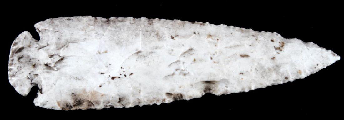 LATE PALEOLITHIC ERA PRE COLUMBIAN LITHIC BLADE: Paleolithic South American found spear or knife blade. Measures 6 3/4 inches in length with a semicircular cleaved pommel for fastening, cleaved from a white stone. Item is in good condition with expe