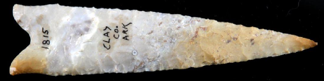 ARCHAIC DALTON CLASSIC ARROWHEAD POINT CLAY CO AR: Beautiful Dalton measuring 4.5 inches long. Fine collateral flaking, beige orange chert, marked with site number, serrations, excellent condition. From Clay Co., Arkansas. This lot has a reserve.