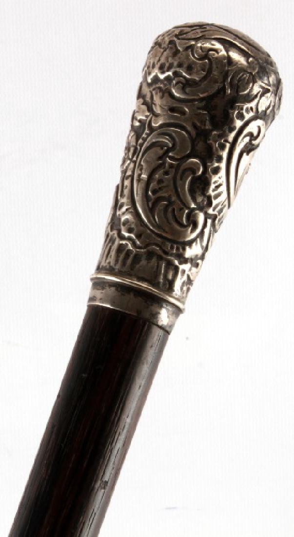 ANTIQUE SILVER HANDLE WOODEN WALKING STICK CANE: Antique walking stick with a large silver head. Measures 34 inches in overall length, with the head measuring 4 inches long. In very good condition overall, with some tarnish to the handle, some scuff