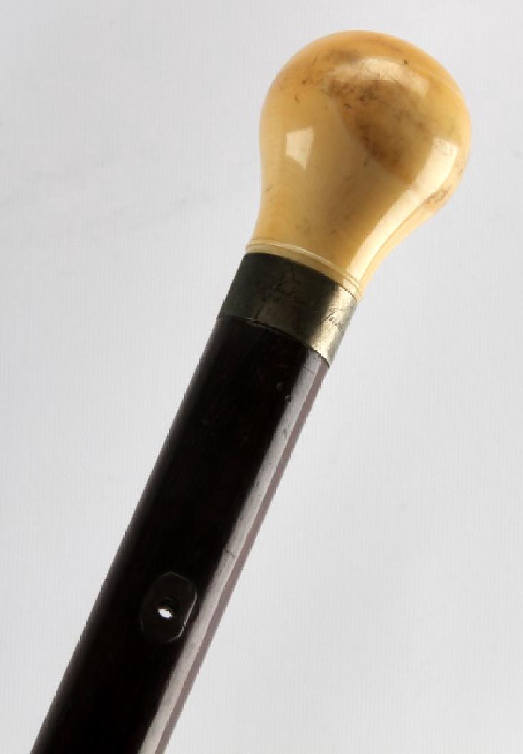 1850 DATED PRESENTATION WALRUS TUSK GRIP CANE: "M.H. to L. Jackson 1850" inscribed on silver wrap below walrus grip, very fine dark maple wood with place for lanyard. Provenance Memphis Tennessee John Montague collection. Exceptional condition for