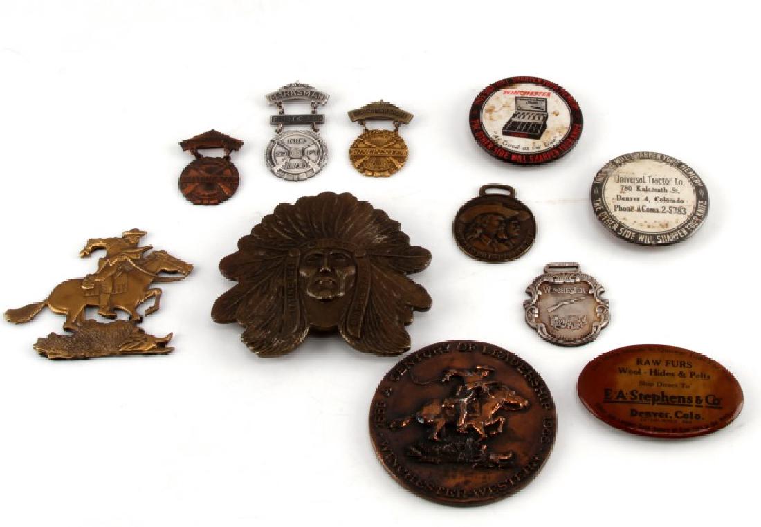 ANTIQUE ADVERTISING WINCHESTER HIDES TRACTOR MORE: Riker mount containing 3 advertising buttons with knife whetstone on back, Winchester, Universal Tractor Denver, Stephens & Co, Raw Furs Denver, also Sitting Bull belt buckle, Buffalo Bill fob, Winche