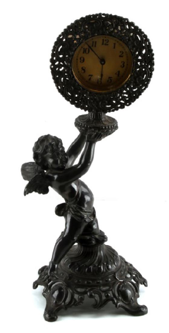 19TH C ANTIQUE BRONZE ANGEL MECHANICAL CLOCK: Antique bronze baby angel mechanical clock. Unmarked. Clock partially runs after winded. VG condition. Light oxidation to exterior. Circa 19th century.