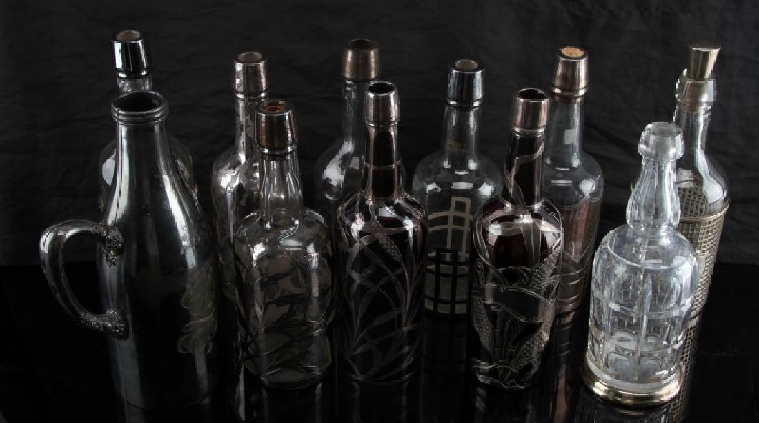 ANTIQUE SILVER OVERLAY BAR BACK LIQUOR BOTTLES: Lot off 10 bottles and 1 holder with silver or silver plated overlay. Several are marked and one hallmark dates to 1895 Meriden Britannia Co.