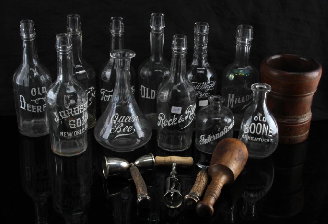 VINTAGE BARTENDER TOOLS BOTTLES MORTAR W PESTAL: Vintage bottles with are labeled in white enamel. Bottle opener, corkscrew and jigger have horn handles. Mortar and Pestal are solid wood. All items are pre used and show wear 2 bottles have chipping 