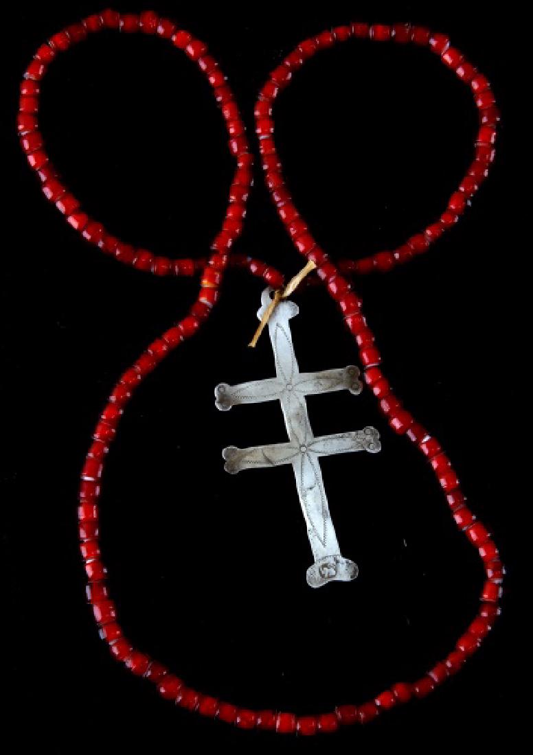 ANTIQUE NATIVE AMERICAN FUR TRADE ERA SILVER CROSS: Silver two-barred Cross of Lorraine from the fur trade with Native Americans. Has a hallmark consisting of a lion en passant facing left with a sword in it's right paw, 3 1/4 inches in length, with a