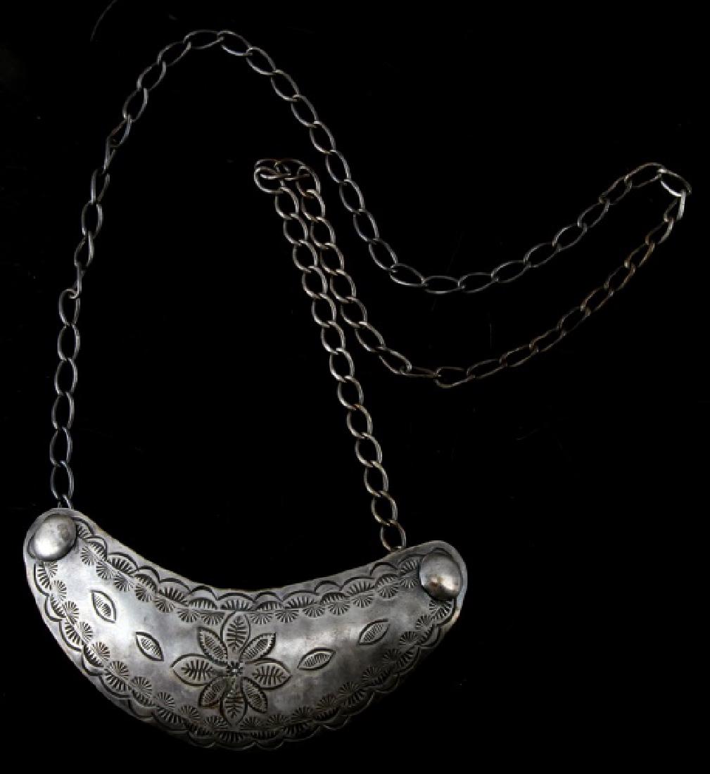 NATIVE AMERICAN ETCHED SILVER TRADE GORGET W CHAIN: 4 1/4" Etched design trade gorget & chain tested positive for silver. Weighs 1.47 ozt (45.5 grams) with some patina and normal wear consistent with age present. This lot has a reserve.