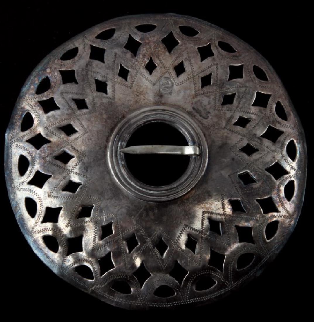 NATIVE AMERICAN ANTIQUE SILVER FUR TRADE PENDANT: Measures 3 1/4 inches in diameter and in very good condition. The obverse has a hallmark of a snake. It has been tested for silver content. Ex. Montague collection. This lot has a reserve.