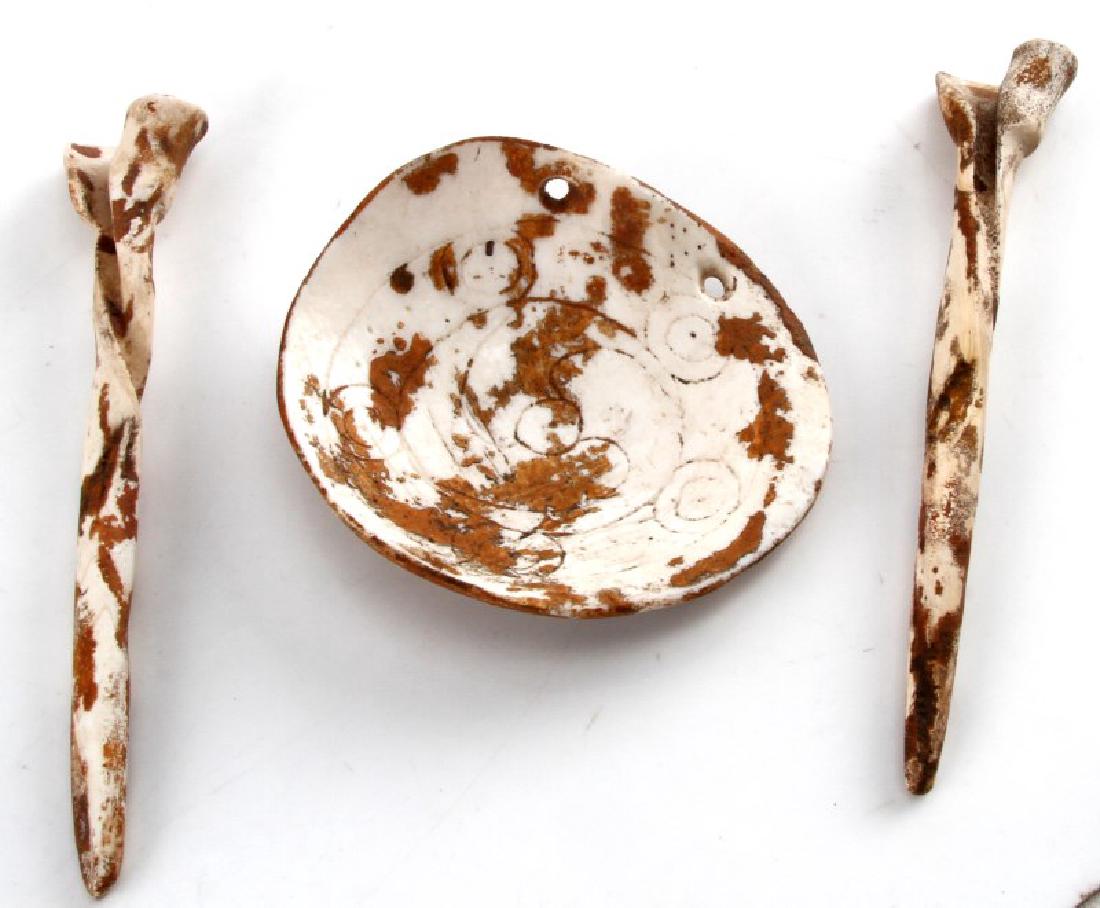 NATIVE AMERICAN SHELL GORGET AND EAR PLUG SET: All are in very good condition. Gorget has a hand carved pattern maybe Hopi. Ear plugs measure 7 inches long each.