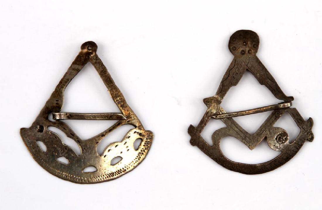 PAIR OF NATIVE AMERICAN FUR TRADE SILVER BROOCHES: Pair of Native American Silver fur trade era Marked silver brooches both fashioned in the Masonic shape of two opposing pyramids also known as the "square and compass of masonry" with a central diamon
