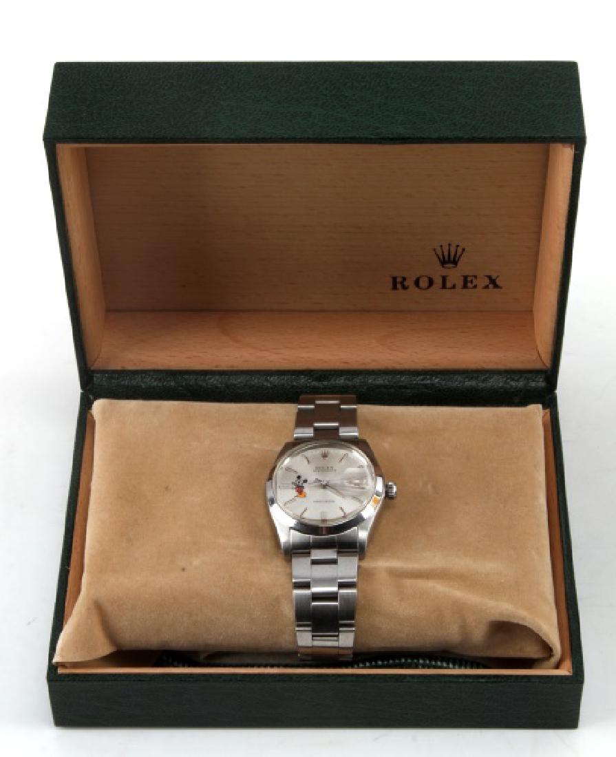 ROLEX 6694 VINTAGE MICKEY MOUSE OYSTERDATE WATCH: Includes watch and original band. Band shows some wear and scratches. Watch shows minor wear around rim visible in photographs. Automatic and still functioning. Overall in very good condition. Include