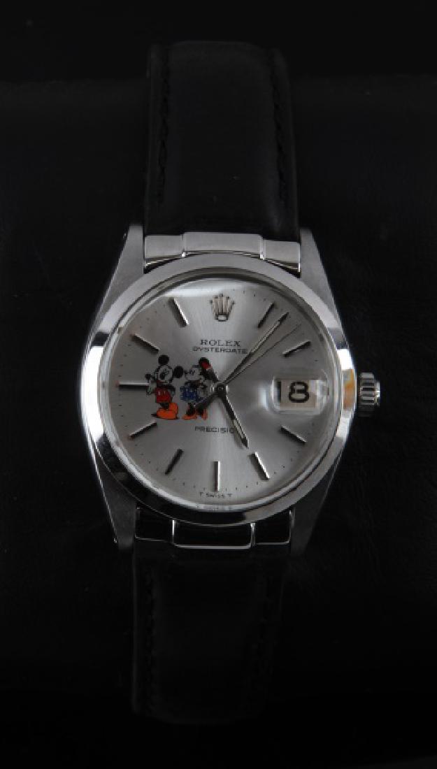 ROLEX MICKEY & MINNIE OYSTERDATE WATCH 6694: Original watch with replacement strap. Minor wear present. Automatic watch is still functional. Overall in very good condition. Case not included.