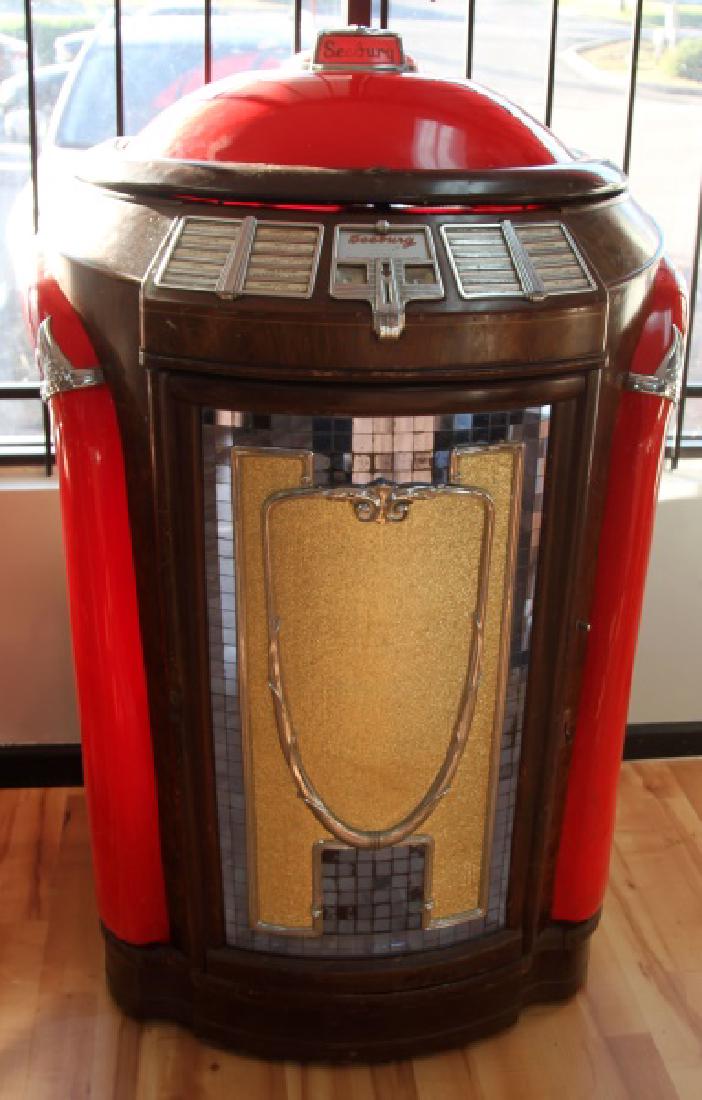 1946 MOD 146 SEEBERG SYMPHONOLA TRASHCAN JUKEBOX: 100% Original Model 146 S/N 130859, has original records with metal supports, we have tested and works well for the most part, shifts records smoothly and all electrics work, coin drop is disconnected