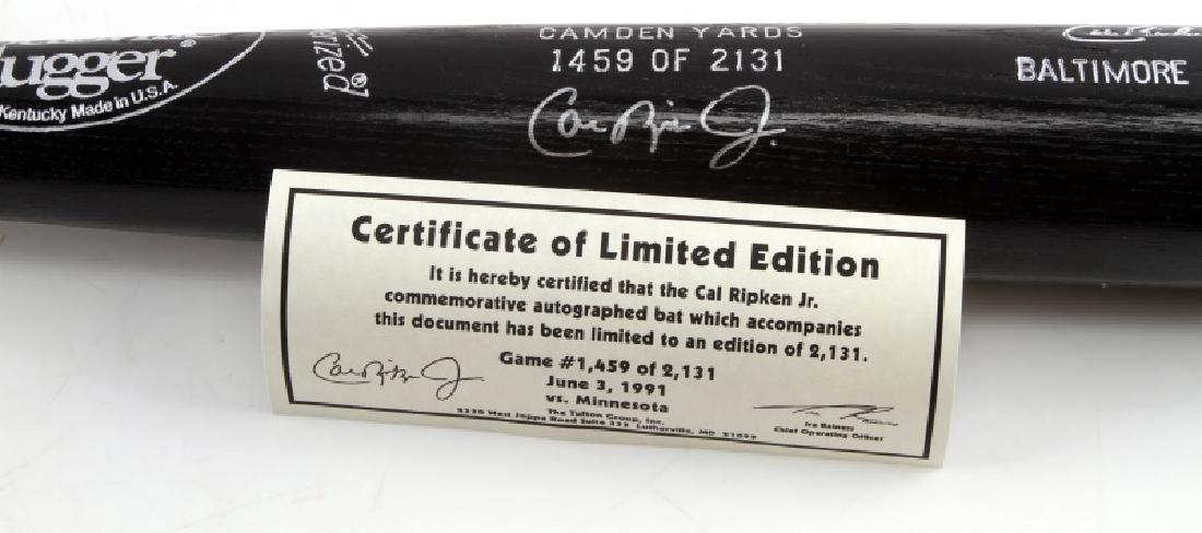 CAL RIPKEN JR SIGNED AUTOGRAPHED BASEBALL BAT: Black Louisville Slugger 125, autographed by Cal Ripken Jr., with a certificate of authenticity included which identifies this bat as #1459 of 2131. In excellent condition, still in storage case.