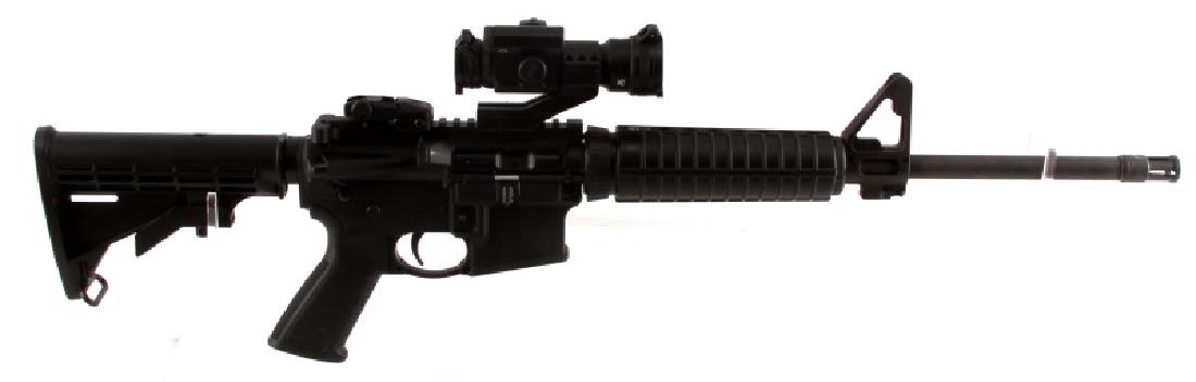 RUGER AR 556 SEMI AUTOMATIC RIFLE IN 5.56 NATO BAG: All black steel and polymer construction. Strikefire scope attached. Barrel measures just under 18 inches long (including muzzle break), bore is bright and clean, M4 feed ramps, extendable stock. Very
