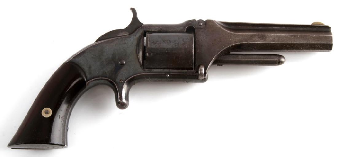 SMITH & WESSON MOD 1 1/2 FIRST ISSUE REVOLVER .32: .32 Rimfire 5 shot revolver with blued steel finish (50%), varnished wood square butt grips, two line maker and patent dates to top barrel flat (1855 & 1859), 3 inch barrel, serial no. 3781 to butt, n