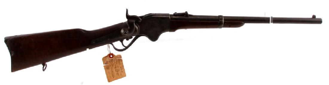 1865 SPENCER REPEATING LEVER ACTION RIFLE .52 CAL: Carbine rifle with iron furniture, wood stocks, M1865 marked to top of barrel in front of receiver, serial no. at breech, 20 inch round barrel with dark bore and pitting, saddle ring to left side, sli