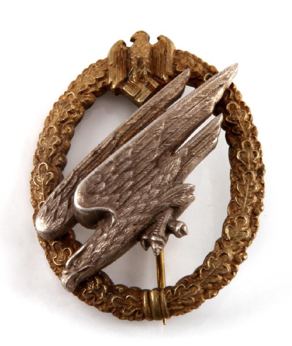 WWII GERMAN THIRD REICH PARATROOPER NAMED BADGE: Superb real .800 silver 2nd type badge without safety catch, engraved to Oberjager Holler in Fallschirm Inf. Comp, Straight pin to a point. This lot has a reserve.
