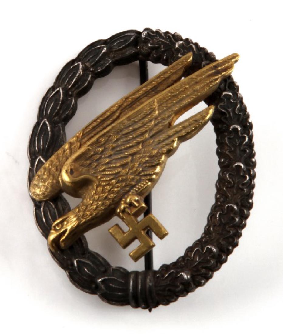 WWII GERMAN 3RD REICH LUFTWAFFE PARATROOPER BADGE: C.E. Junker Berlin S.W. stamped back 90 degree pin lie, highly detailed quality construction. This lot has a reserve.