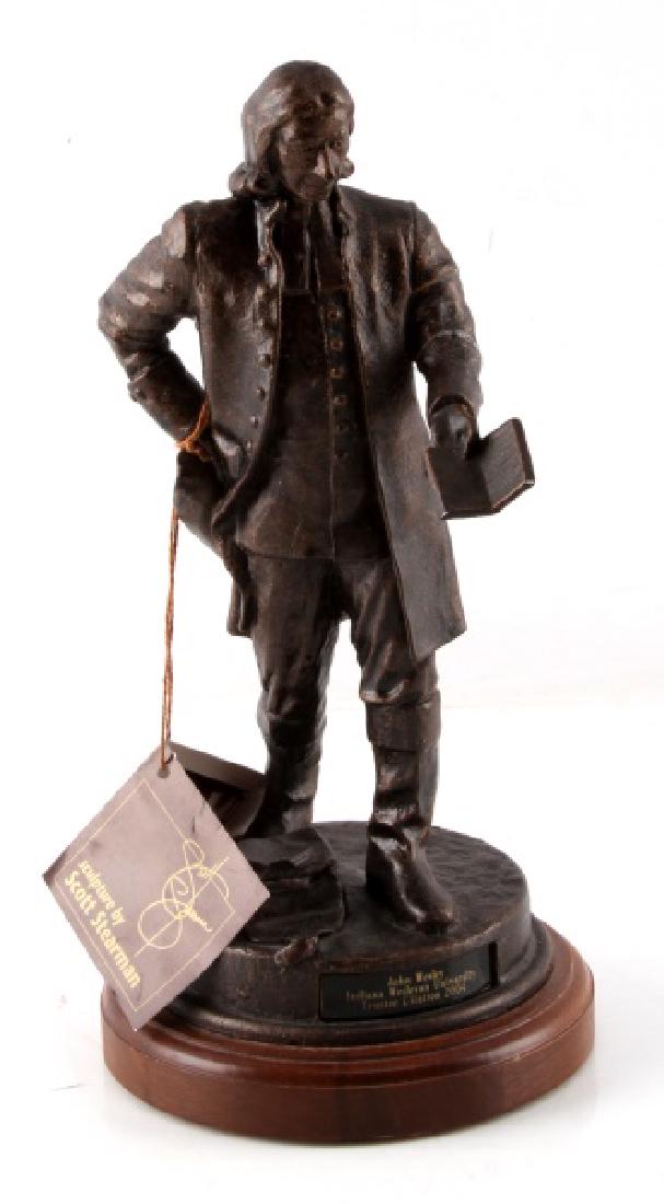 BRONZE SCULPTED FIGURE OF JOHN WESLEY BY STEARMAN: Bronze Sculpted figure of John Wesley by sculptor Scott Stearman, marked on wooden base of sculpture with small plaque that reads John Wesley Indiana Wesleyan University Trustee Citation 2004. Left ar