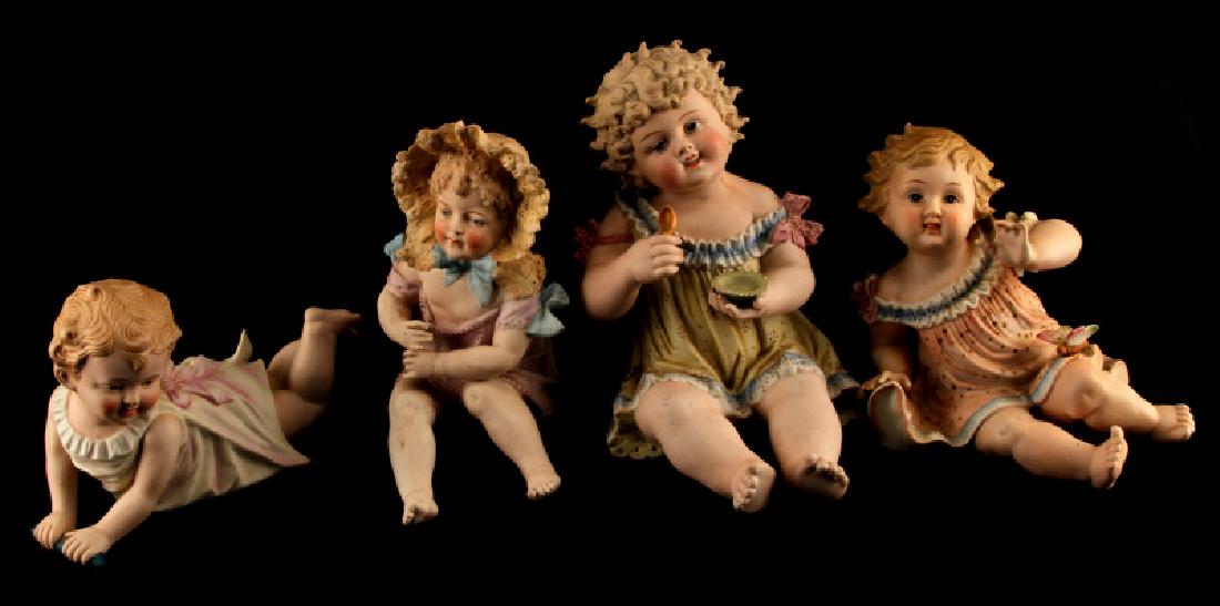 LOT OF 4 SADEK PORCELAIN PIANO BABY CHILDREN: Includes Andrea 23/542 (VG), Reclining 23/107X (VG), 12" Marked German Child Holding Bowl And Spoon (G, crack behind leg), and child playing flute 8881 42 (Fair, chip in right shoulder).
