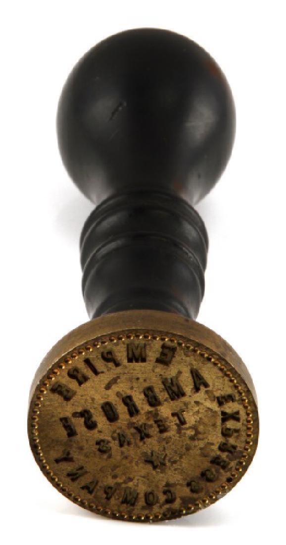 VINTAGE EMPIRE EXPRESS CO AMBROSE TEXAS HAND STAMP: Dark wooden handle with small white "E" engraved into top. Brass stamp. Measures approx. 3.75 inches in length with 1.25 inch strike plate. Very good condition with some normal age wear and discolorat