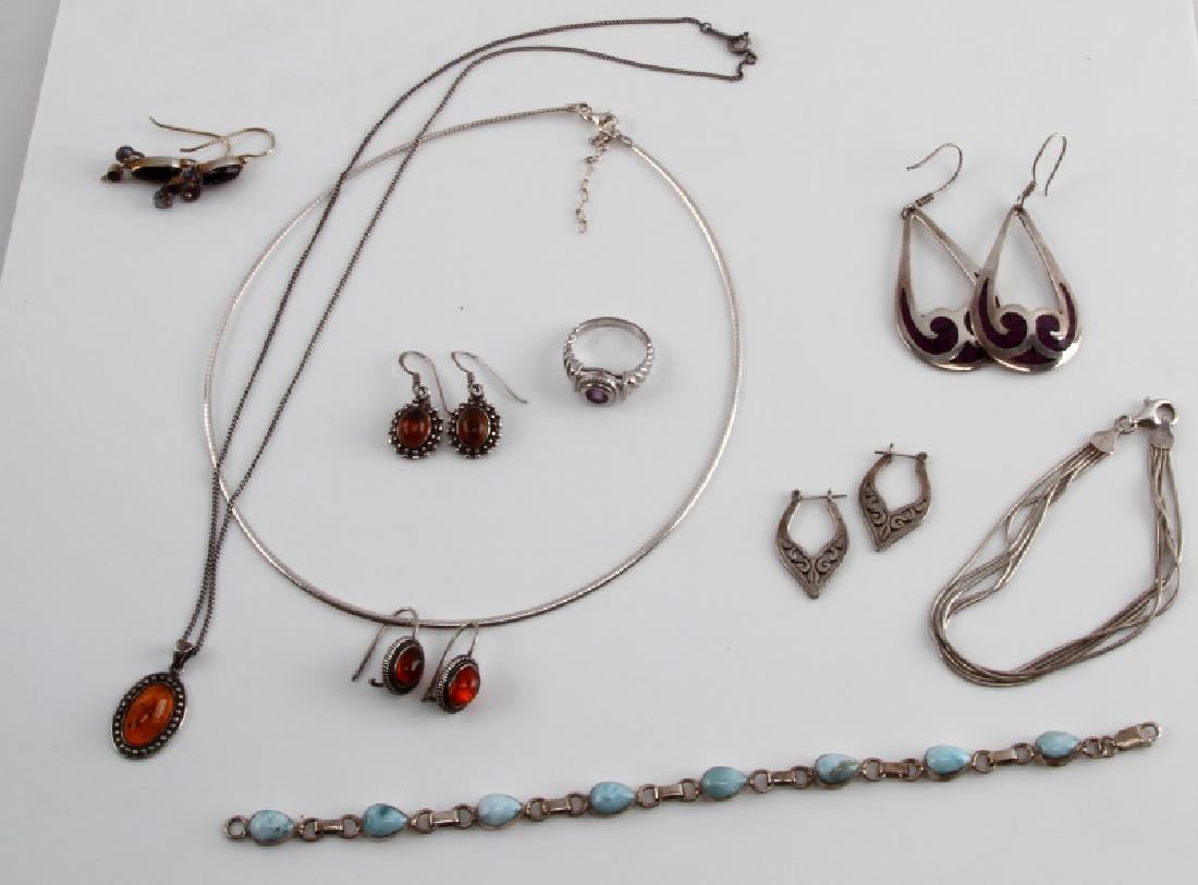 VINTAGE STERLING SILVER AND GEMSTONE LOT: Lot includes 1 silver choker necklace, 1 silver necklace with amber pendant , 1 silver bracelet, 1 Larimar and silver bracelet , 5 pairs of earrings( 2 with amber) and 1 size 7 1/2 amethyst ring.