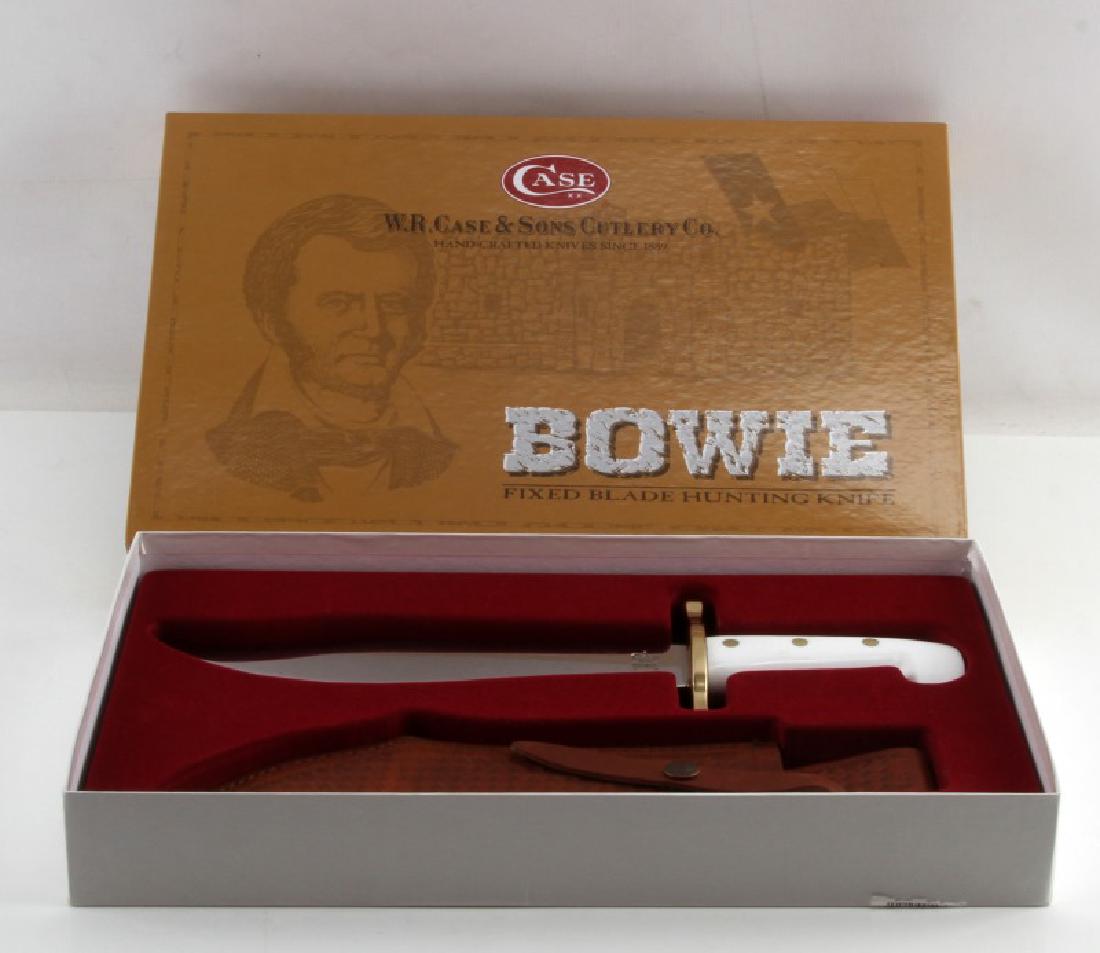 CASE HUNTER BOWIE FIXED KNIFE W SHEATH NIB 02000: Model #02000. True-Sharp surgical stainless steel fixed blade, white synthetic handle with brass guard. Mirror polished, taper ground blade. Genuine leather sheath. Total length: 14.25 inches (blade l