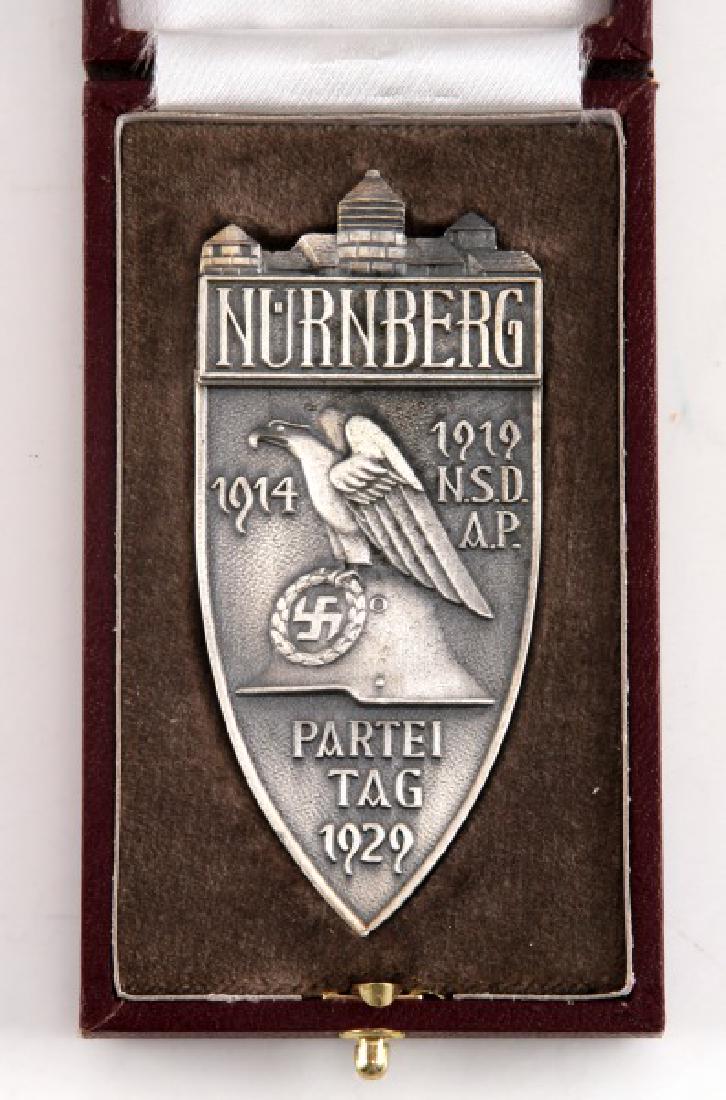 WWII GERMAN THIRD REICH NSDAP PARTY DAY 1929 MEDAL: 1929 Nurnberg Party Day medal. In very good condition, tested for silver content, and maker marked F. Hoffstatter Bonn 800'. Comes in a burgundy case with 'Reichsparteitag Nurnberg 1929' stamped in go