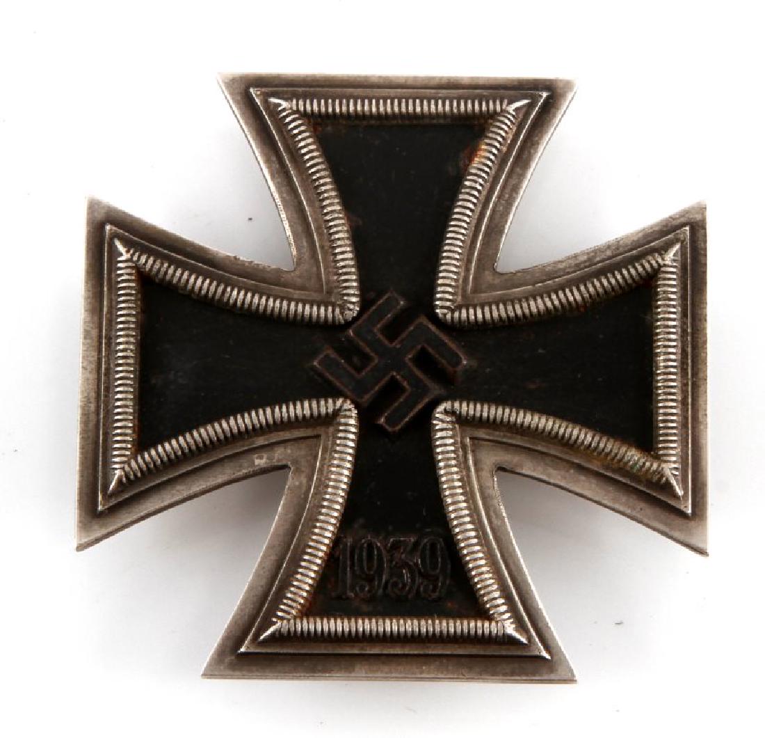 WWII GERMAN THIRD REICH IRON CROSS 1ST CLASS BADGE: In very good condition with magnetic core. Some wear to center. Flat pinback no makers mark. Unauthenticated sold as is This lot has a reserve.