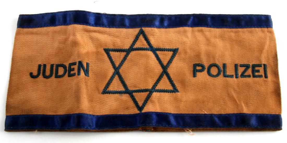 WWII GERMAN THIRD REICH ARMBAND RUSSIAN MOVIE PROP: In very good condition some discoloration. This is from a Russian movie studio. The inside is marked from the studio. This lot has a reserve.