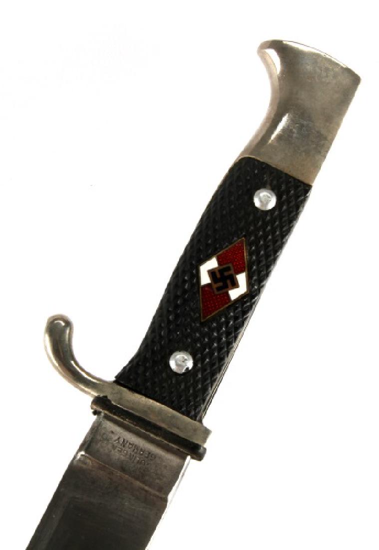WWII GERMAN THIRD REICH HITLER YOUTH HJ KNIFE: Knife and sheath of a Hitler Youth (HJ) member. Bakelite grip, and with a leather buffer pad. In very good condition overall, with the black paint coming off of the scabbard and minor tarnish on the h