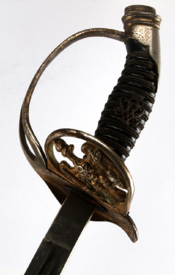 WWI IMPERIAL PRUSSIAN OFFICER SWORD & SCABBARD: Wrapped Bakelite grip, dent free scabbard and possibly repainted some time ago, very good double blood groove blade.