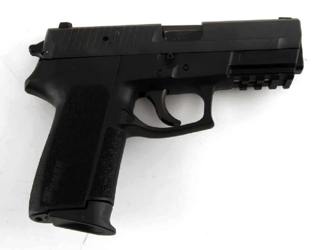 SIG SAUER SP2022 SEMI AUTOMATIC PISTOL .40 S&W: All black steel and polymer construction, 3.75 inch barrel with good clear bore, fixed front and rear sights. Very good condition. Comes with hard case. Requires FFL for transfer. Caliber: .40 Serial 