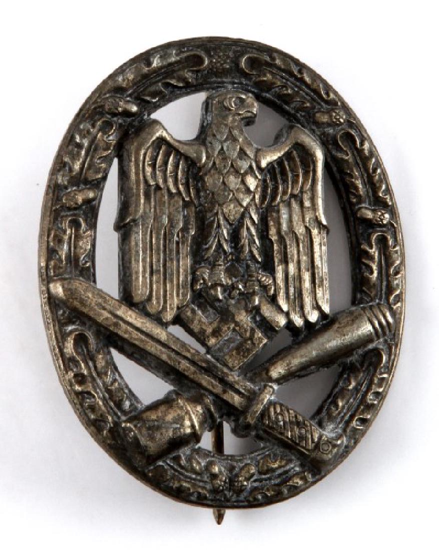 WWII GERMAN GENERAL ASSAULT BADGE JOSEF FEIX SOHNE: Silver tone, Nazi eagle within wreath and crossed bayonet and mallet below, straight pin with c-hook closure. JFS mark to back center. Very good condition.