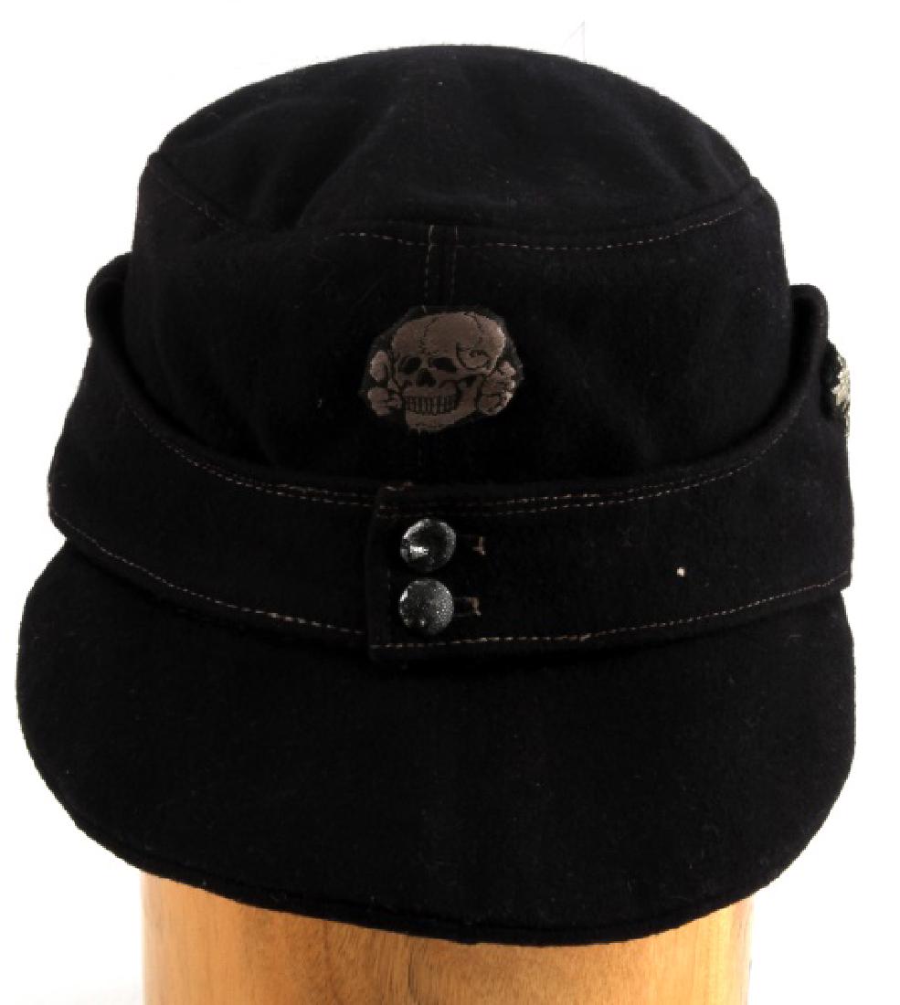 WWII GERMAN THIRD REICH WAFFEN SS M43 FIELD CAP: M43 field cap made of black wool, with the side Reichsadler and Totenkopf badges of the Waffen-SS. Size stamped "57" inside cap. In very good condition. Does not fluoresce under blacklight.