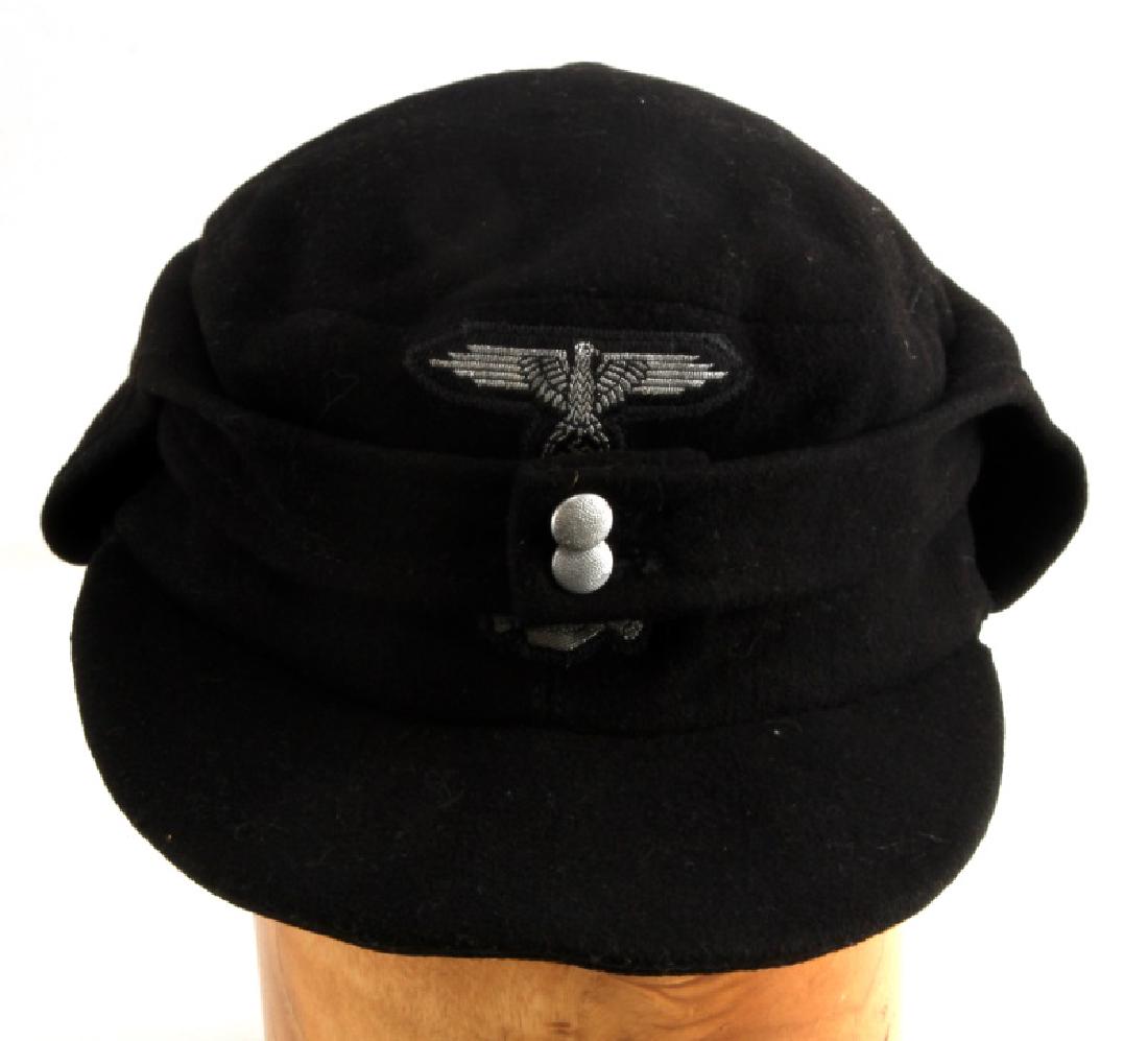 GERMAN WWII WAFFEN SS PANZER M43 FIELD CAP: German WWII Waffen SS Panzer M43 field cap. Features both original pebble buttons. Size 58 marked on grey interior. Light mothing present on top. minor soiling and wear as expected. VG condition. Pass