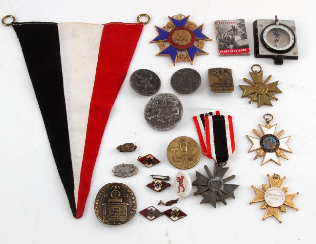 LOT OF 21 GERMAN WWII MEDAL TINNIES PINS MORE: Lot of 19 German WWII pieces. Includes War Merit Crosses (silver, bronze), tinnies, NSDAP pins, Des Fuhrers booklet, Hitler Youth Compass, German pennant, and more. 2 of the pins bear broken backings.