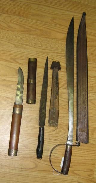 3 WWII MORO BOLO BARONG MACHETE PHILIPPINES LOT: Lot of 3 Philippines knives with wooden and leather sheaths. Sizes varies from 12" to 24" Some of the sheaths damaged and dents on blades. Still very attractive hand carvings.