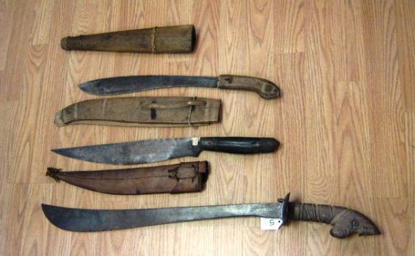 3 WWII BOLO BARONG PHILIPPINES KNIFE MACHETE LOT: Lot of 3 Philippines WWII hand made bolo knives ranging in size between 20" to 28". Leather and wood sheath. Various conditions including some damage to sheaths and dents on blades. Still very intrica
