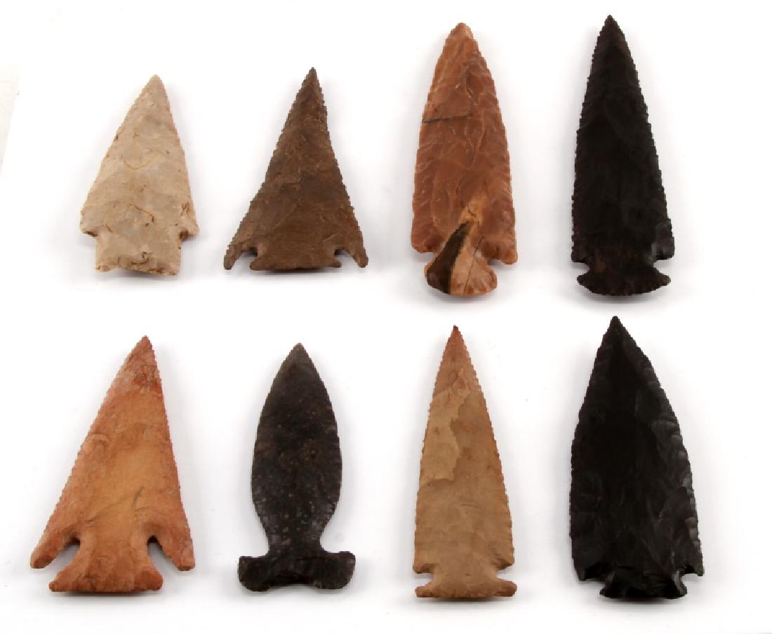 ANTIQUE HAND CARVED CHERT ARROWHEAD LOT OF 8: Lot containing 8 arrowheads carved from chert. First is a 6 inch Kirk point with a collateral flaking pattern. The second point is a Lost Lake point which measures 4 inches in length and has a horizon