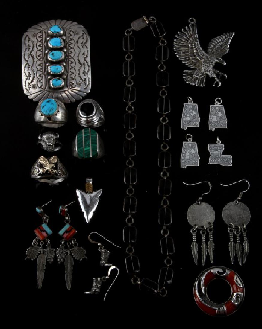 SOUTHWESTERN SILVER CORAL ONYX TURQUOISE JEWELRY: Lot includes Men and women jewelry. Men's : 5 rings( 2 turquoise , 1 onyx, 1 onyx with eagle and 1 buffalo head), 1 silver and turquoise nugget belt buckle, 5 pendant ( 1 eagle, 1 arrowhead, 4 state p