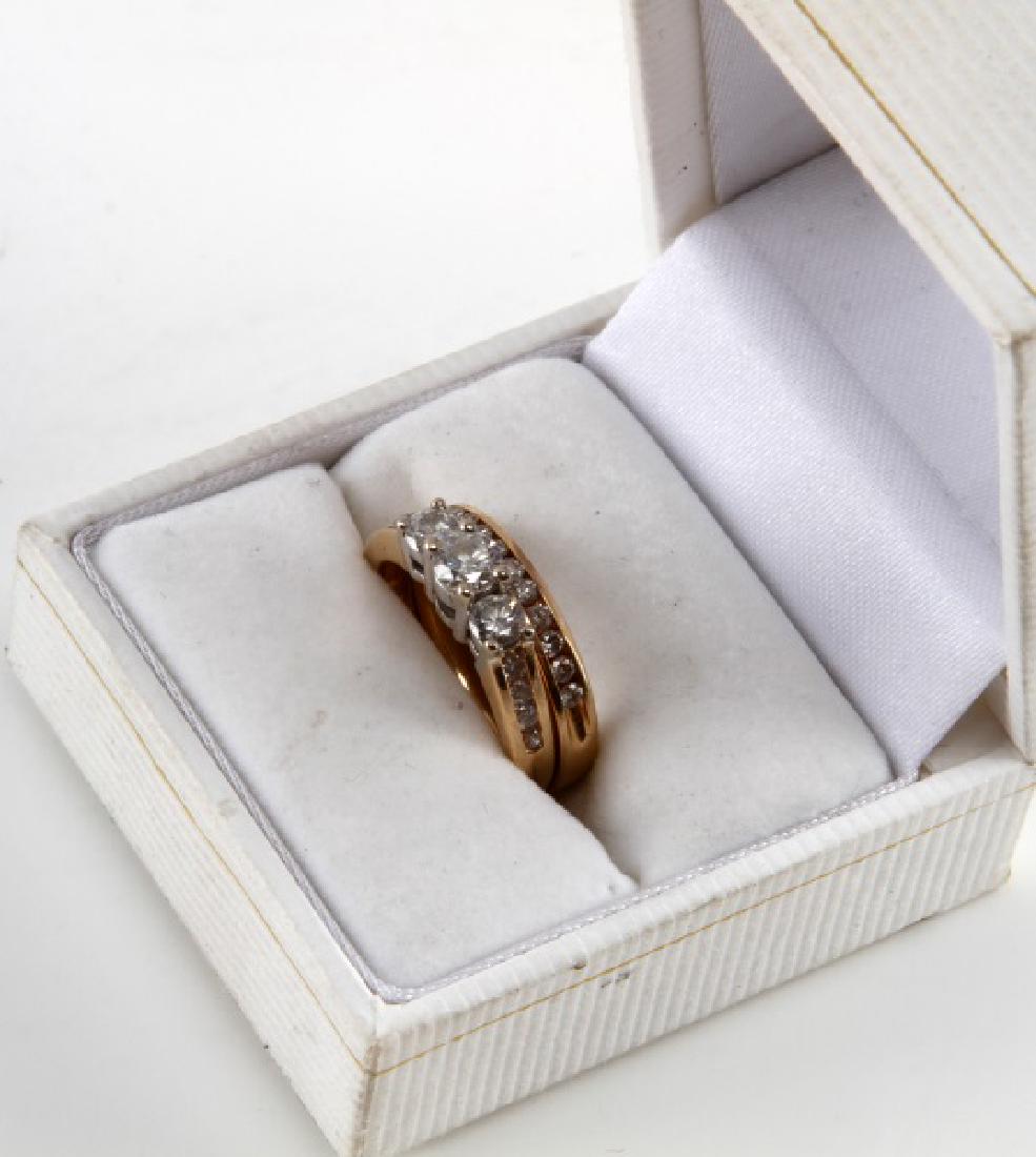 14K YELLOW GOLD & DIAMOND WEDDING RING SET .99 TCW: The main ring features three bigger round cut diamonds (3.5, 4.5, 3.5 mm) with VS2 clarity and I-J color. The surrounding diamonds measure between 1.3 and 1.75 mm each with SI1 clarity and J-K color. 