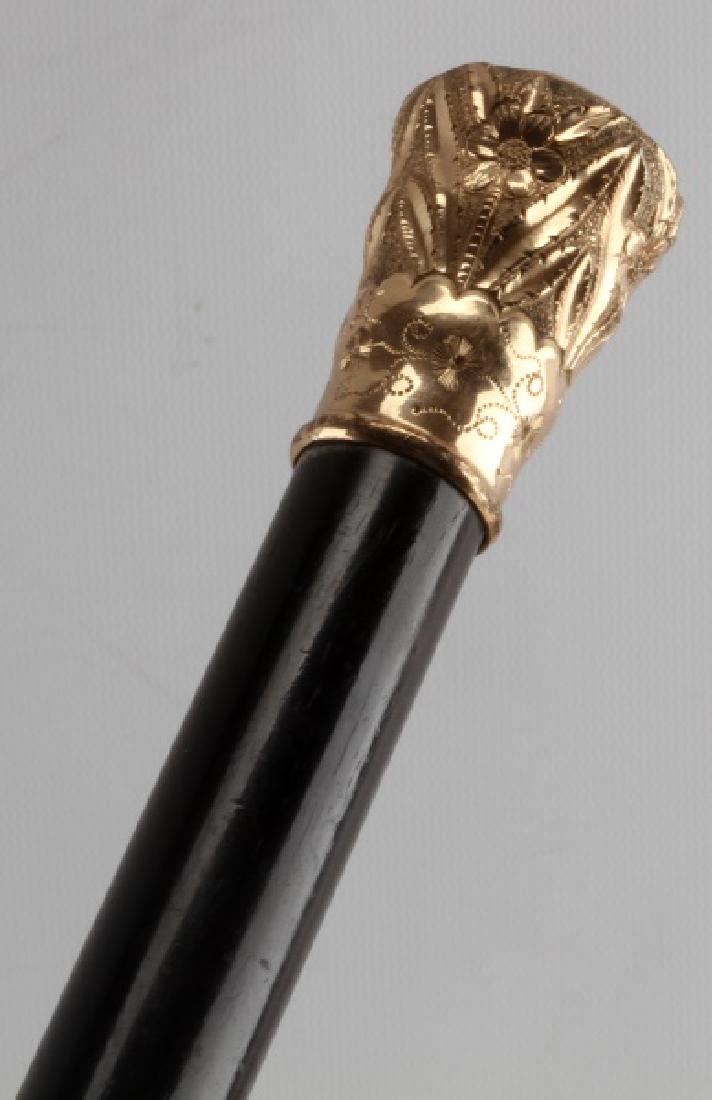 ANTIQUE BRASS & EBONY LADIES WALKING STICK CANE: Brass and Ebonized shaft antique ladies walking cane. Metal ferrule. Brass handle with intricate floral design. Length of 34 and 3/4". Minor wear. VG condition. Face, Dial, Hands: daniel