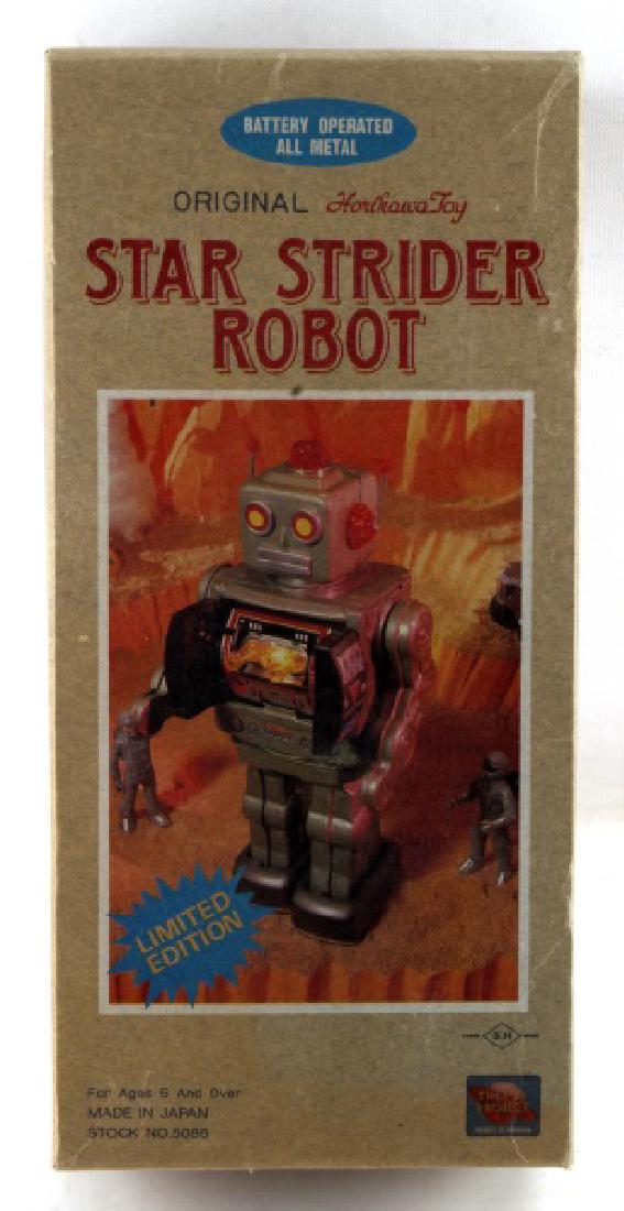 HORIKAWA STAR STRIDER ROBOT JAPAN BATTERY OPERATE: All metal, green color. Measures 12 inches long. In original box. Very good condition.