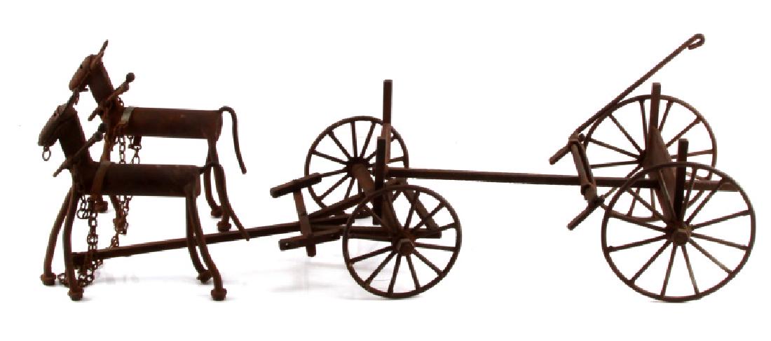 ANTIQUE IRON LUMBER CART AND 2 DRAFT HORSE MODEL: Antique iron statue of two draft horses pulling a lumber cart. In very good condition with some rust and the chain leads having become somewhat misaligned. Measures 29 1/2 inches in overall length, an