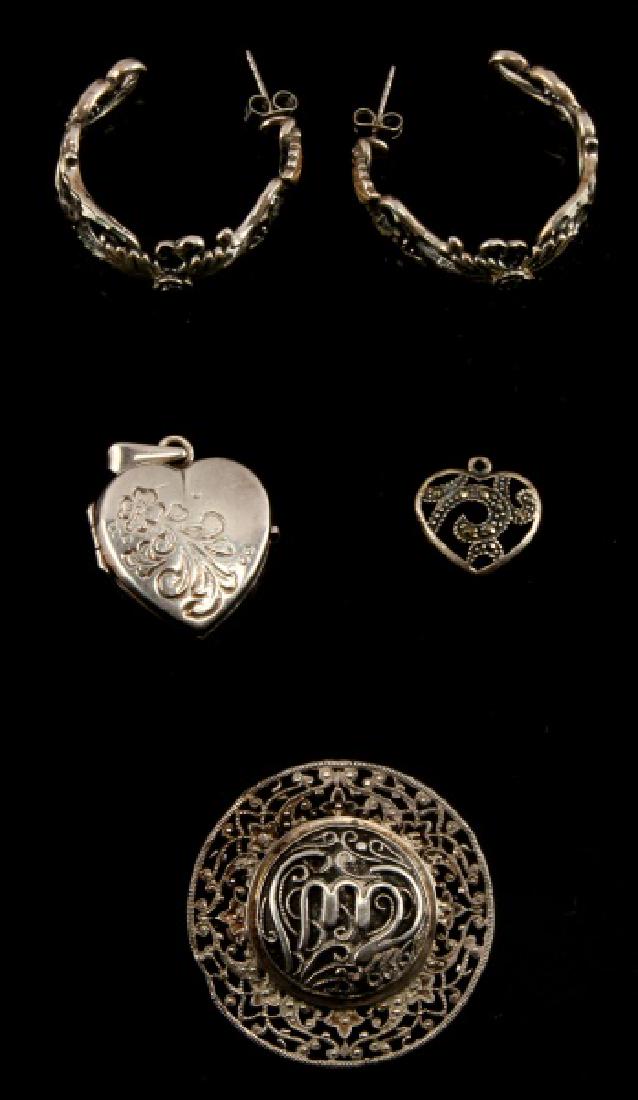VINTAGE SILVER EARRING PENDANT BROOCH JEWELRY LOT: Lot of 4 includes a silver marcasite heart pendant, a silver heart photo locket, a filigree brooch with a small indentation along outer edge and a pair of earrings with rose motif.