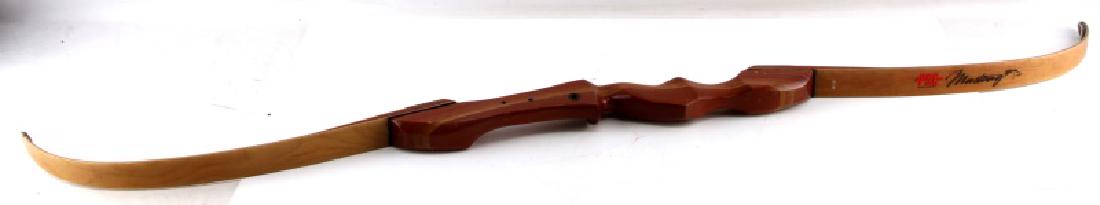 PSE ARCHERY MUSTANG RECURVE BOW HERITAGE SERIES: Smooth finished wood, 60/50, number 50B 0717029 written in black on side, no string, measures 57 inches long (not on curve). Some wear, overall, good condition.