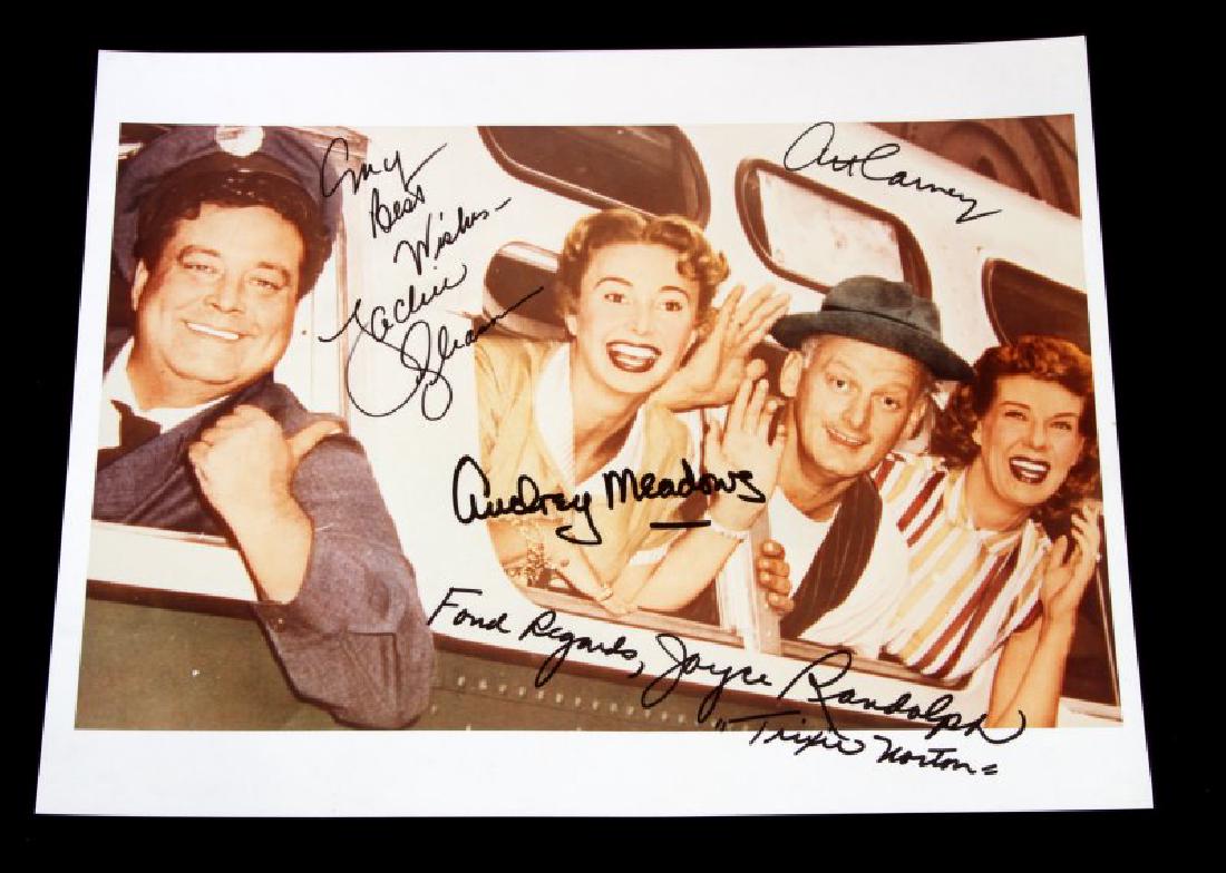 SIGNED PHOTO OF CAST FROM TV'S "THE HONEYMOONERS: 8x10 color lab photo, in very good condition, with guaranteed authentic autographs of Jackie Gleason, Art Carney, Audrey Meadows, and Joyce Randolph, the cast of television's "The Honeymooners". Comes