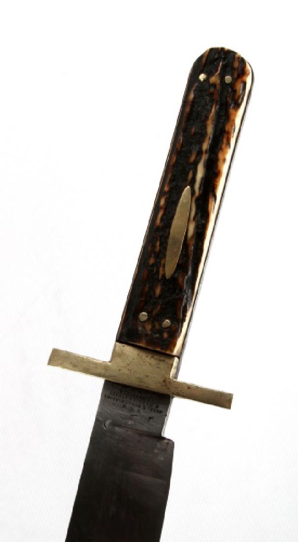 JOSEPH ROGERS & SONS SHEFFIELD BOWIE KNIFE: Measures 14 inches with a 9 inch blade. Has some tarnishing but in overall very good condition. Marked with a crown with a V and R one on each side also marked Joseph Rogers & sons Norfolk street Shef